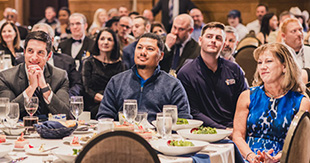 Franchise owners and guests at a BELFOR community event